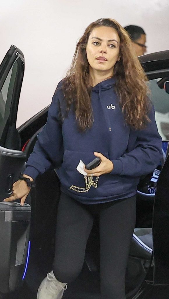 Mila Kunis in a Blue Hoodie