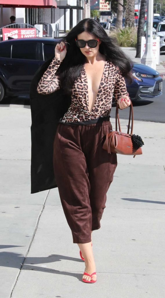 Natasha Blasick in an Animal Print Blouse