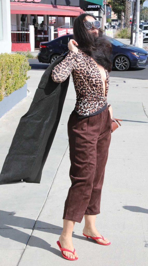 Natasha Blasick in an Animal Print Blouse