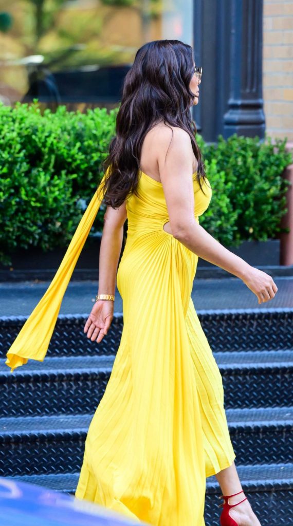 Padma Lakshmi in a Yellow Dress