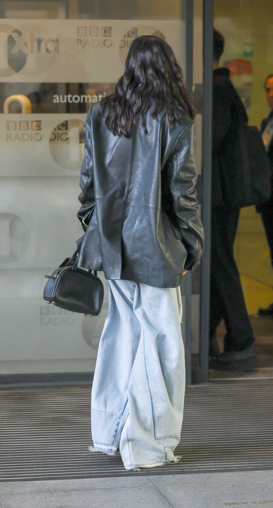 Rachel Zegler in a Black Leather Blazer