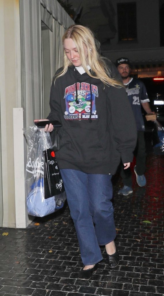Dakota Fanning in a Black Hoodie