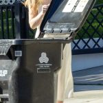 Dakota Fanning in a White Dress Takes in Her Trash Bin in Los Angeles