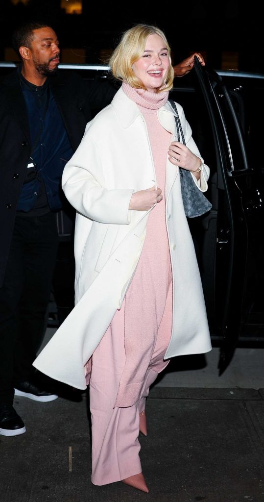 Elle Fanning in a White Coat