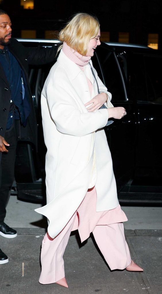 Elle Fanning in a White Coat