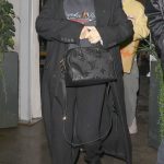 Selena Gomez in a Black Coat Braves the Rain for a Date Night at Saffy’s in Los Angeles