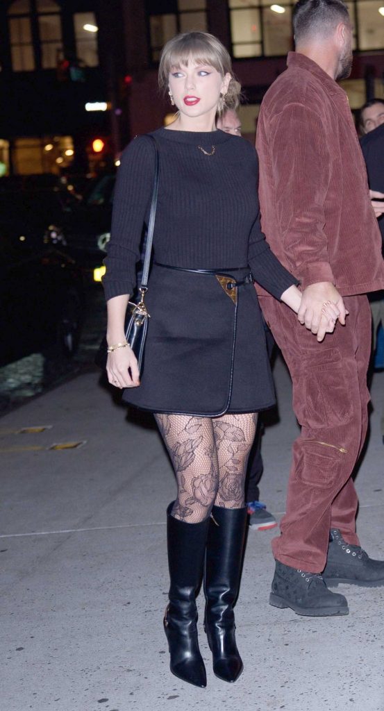 Taylor Swift in a Black Knee-Length Boots