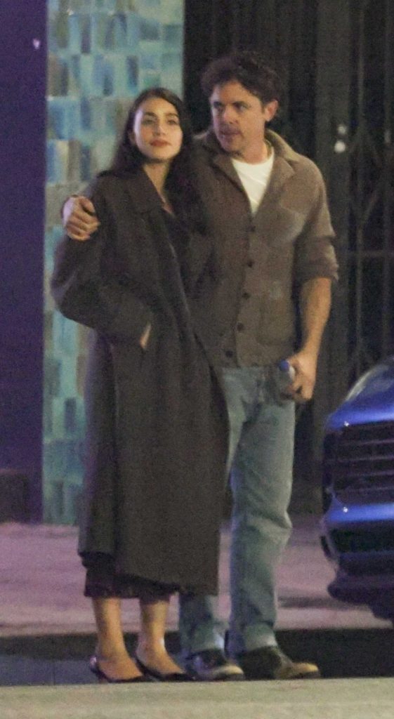 Caylee Cowan in a Black Coat