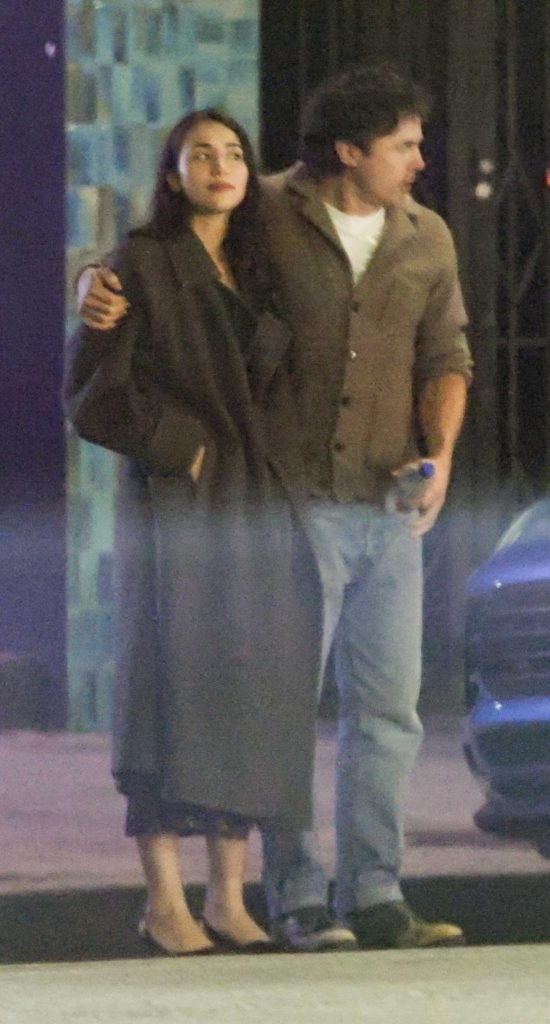 Caylee Cowan in a Black Coat