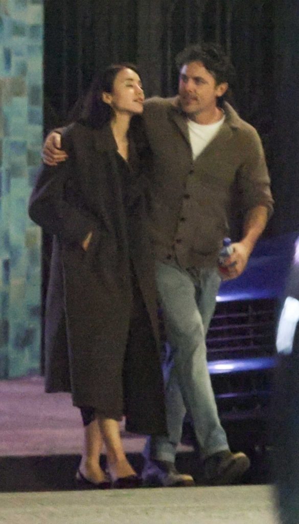 Caylee Cowan in a Black Coat