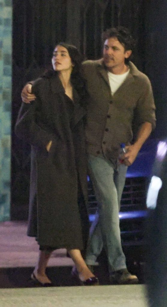 Caylee Cowan in a Black Coat