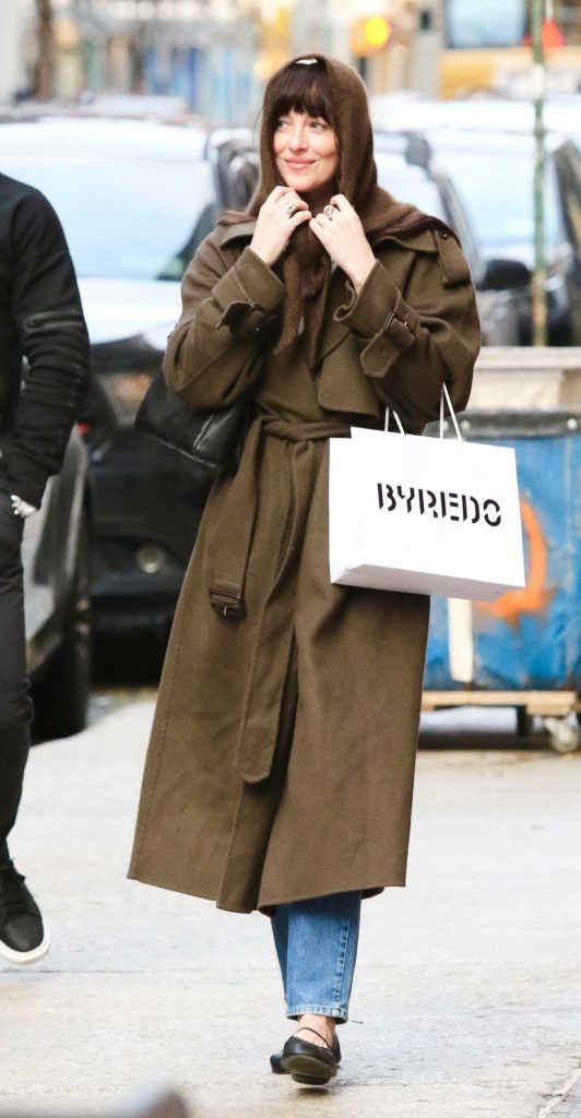 Dakota Johnson in a Brown Coat