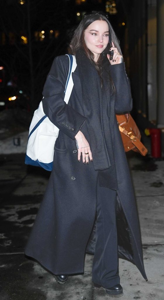 Dove Cameron in a Black Coat