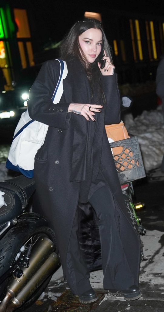Dove Cameron in a Black Coat