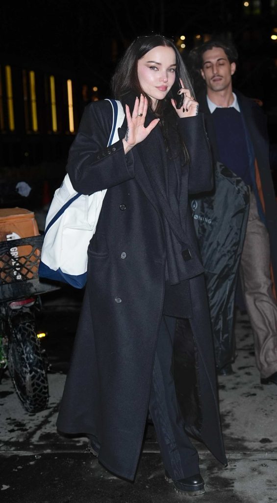 Dove Cameron in a Black Coat