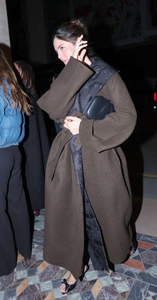 Monica Barbaro in a Brown Coat