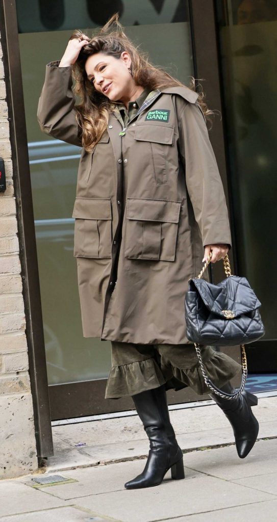 Kelly Brook in a Black Knee-Length Boots