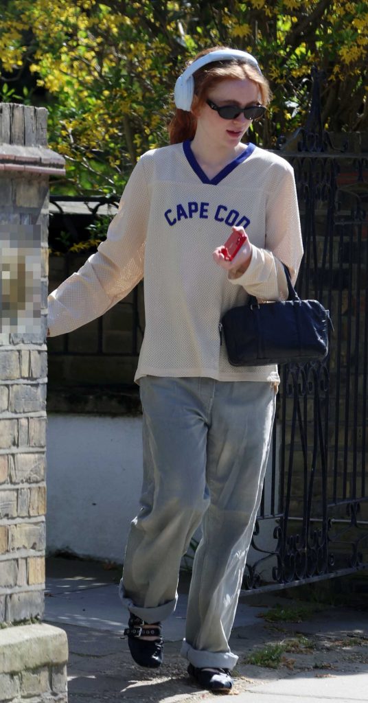 Sadie Sink in a Grey Jeans