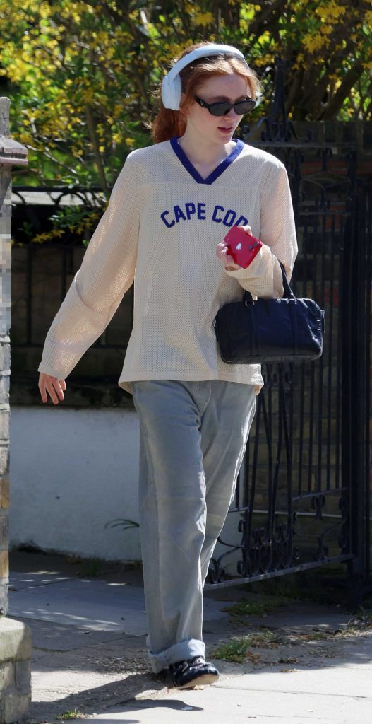 Sadie Sink in a Grey Jeans