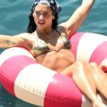 Dua Lipa in a Gold Bikini with Callum Turner on the Sea in a Float in Taormina