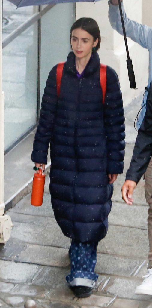 Lily Collins in a Black Puffer Coat