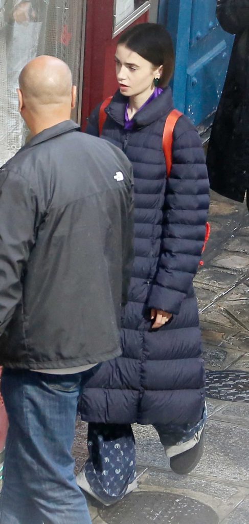 Lily Collins in a Black Puffer Coat
