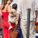 Millie Bobby Brown in a Red Ensemble Takes a Water Taxi Ride with Jacob Bongiovi on Lake Como in Bellagio