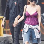 Bella Thorne in a Purple Top Strolling with Fiance Mark Emms During Fashion Week in Milan