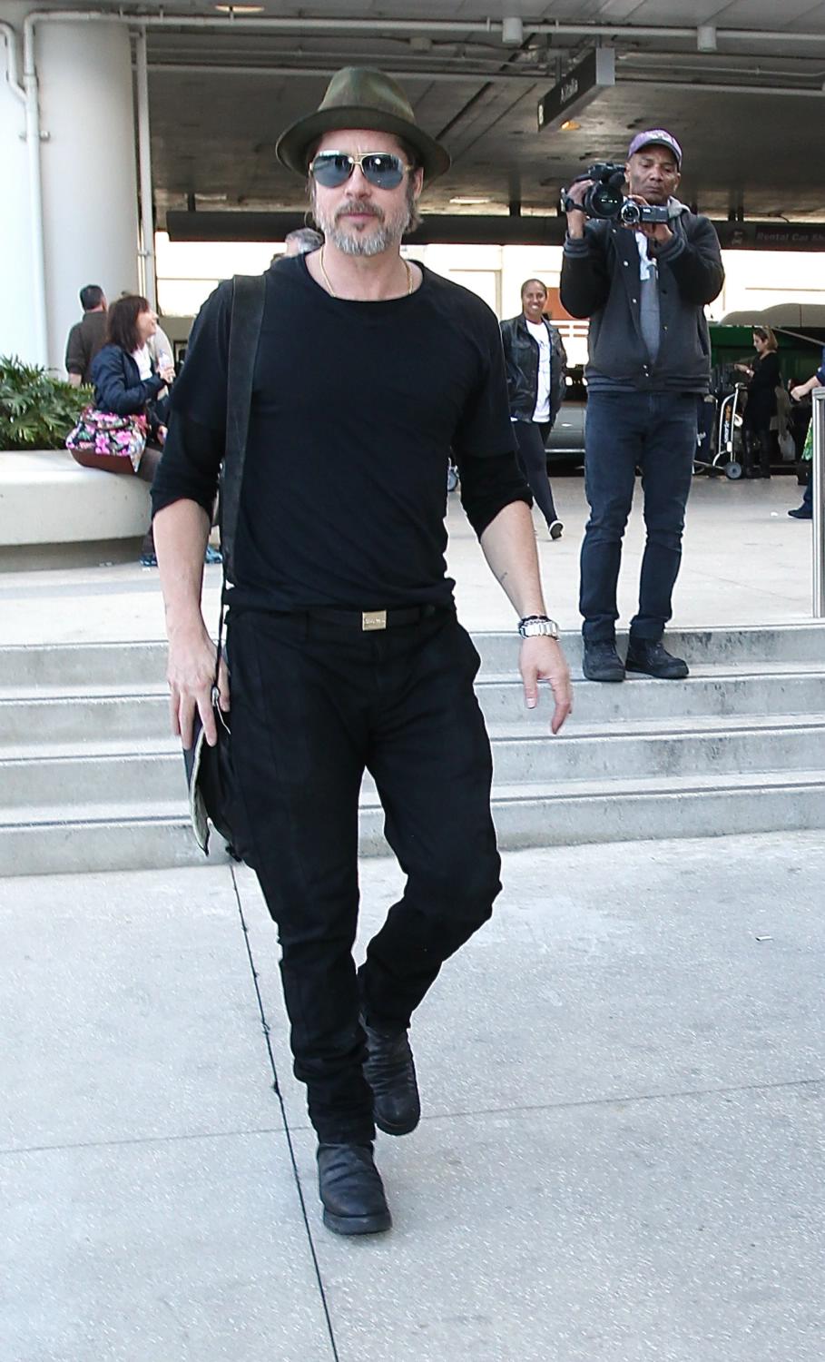 Brad Pitt Arrives at LAX Airport