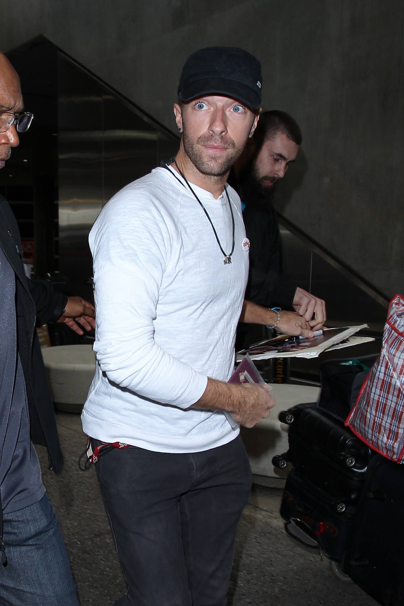 Chris Martin Arrives at LAX Airport Dec