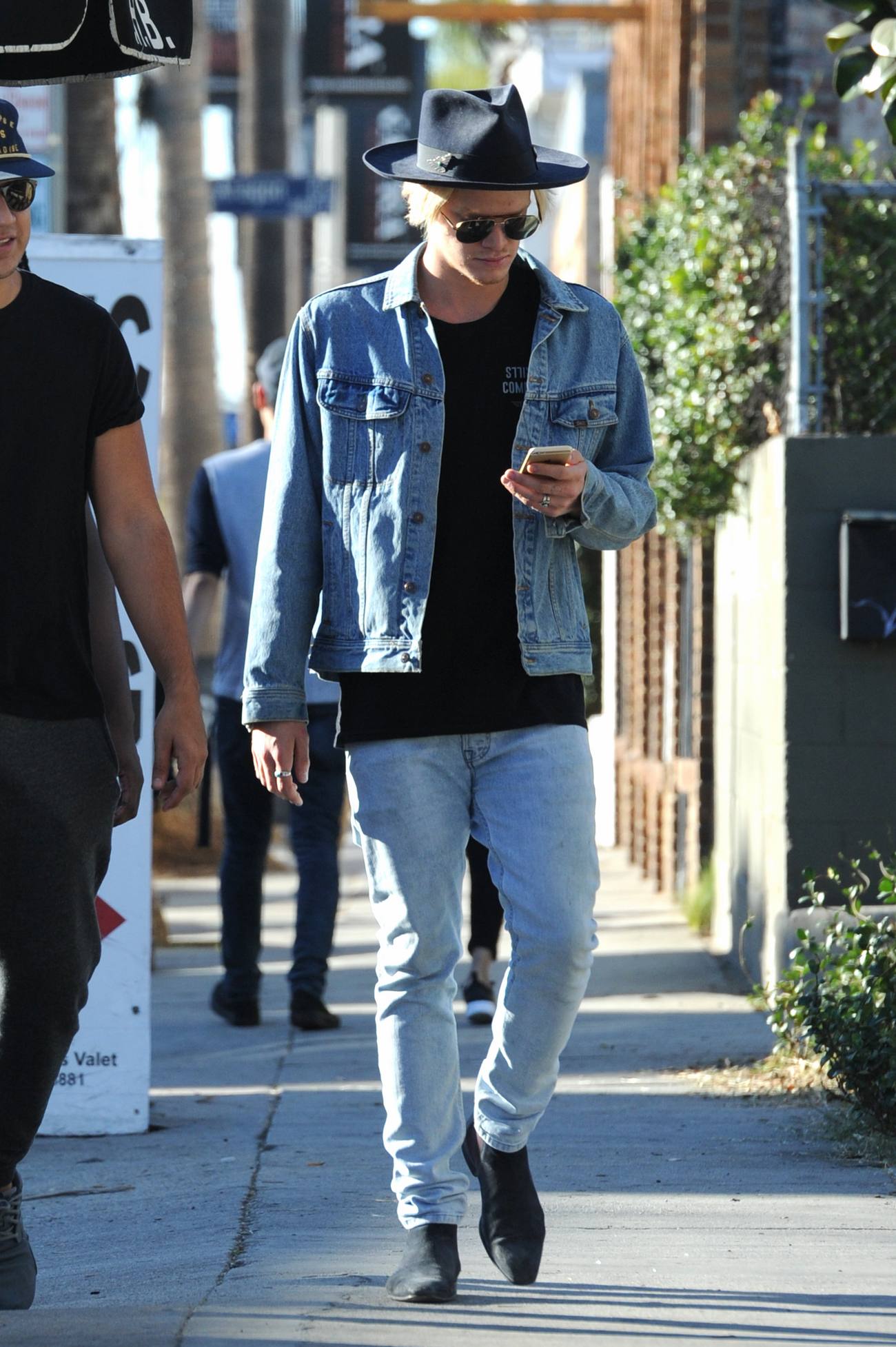 Cody Simpson waits outsidee Liquorore in LA
