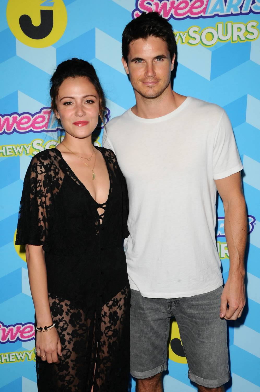 Italia Ricci and Robbie Amell at Just Jared Summer Bash Pool Party ...