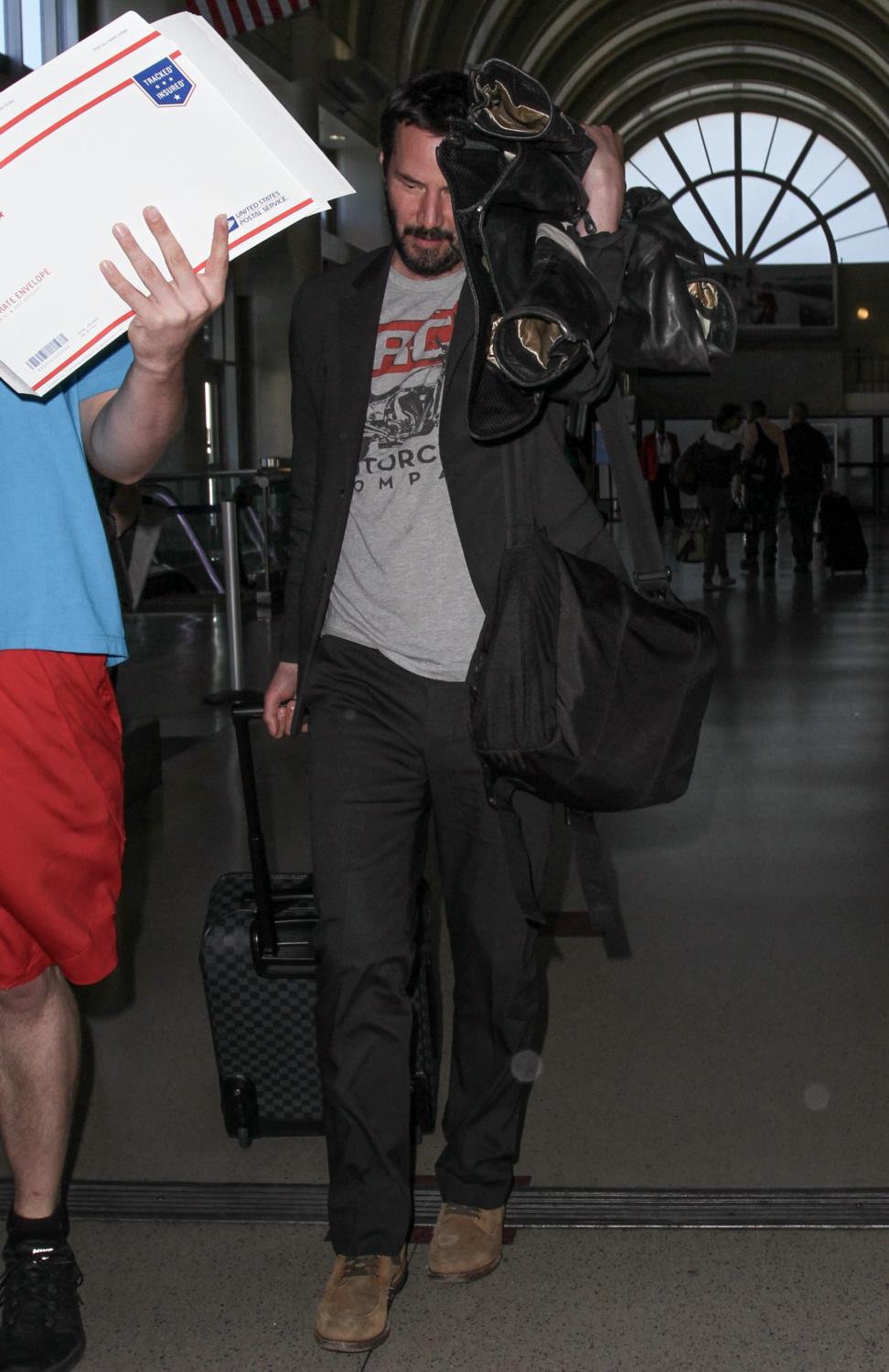 Keanu Reeves departs from Los Angeles International Airport (LAX) carrying Louis  Vuitton luggage, Stock Photo, Picture And Rights Managed Image. Pic.  WEN-WENN22103807