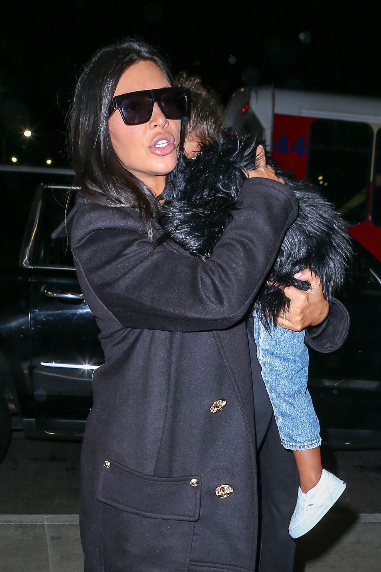 Kim Kardashian With Kanye and Daughter Nori at LAX