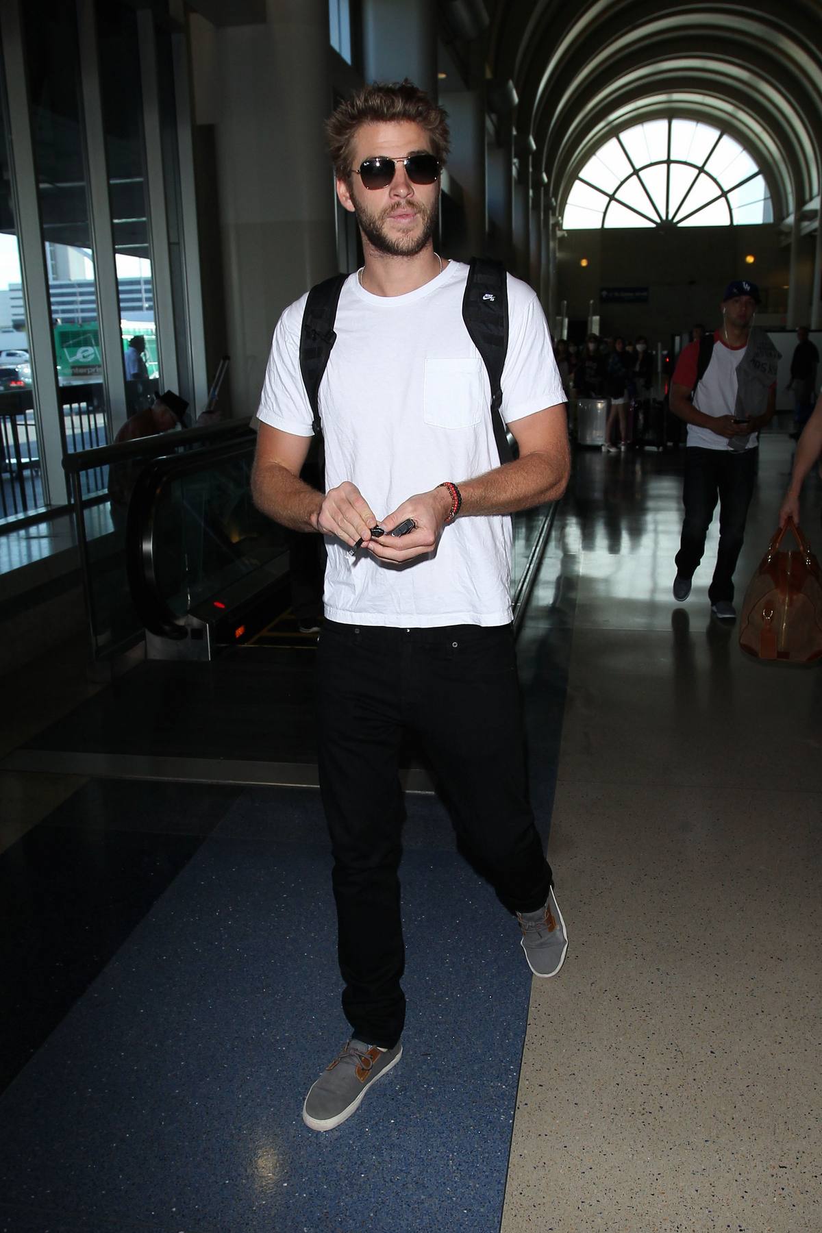 Liam Hemsworth Arrives at LAX Airport