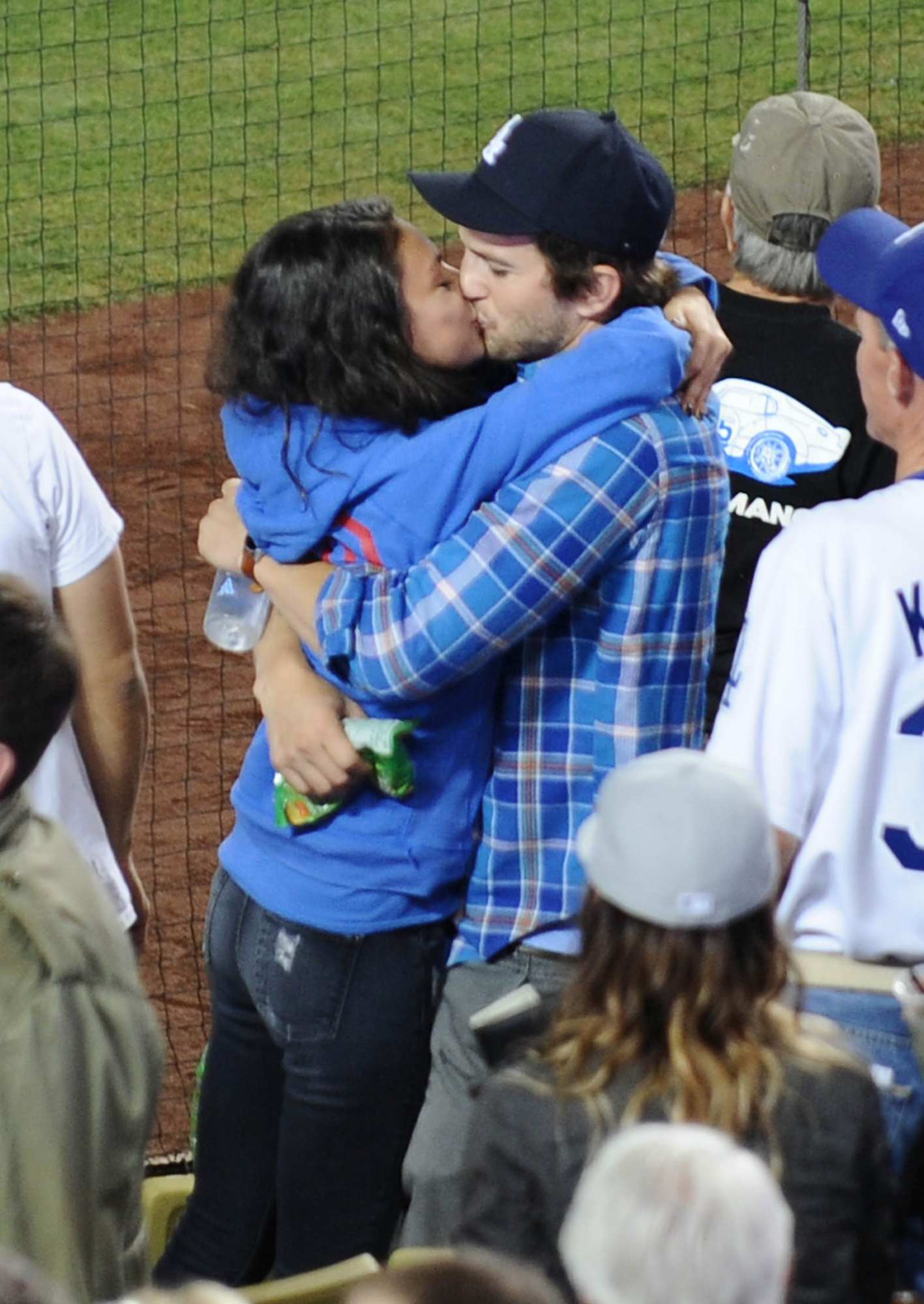 Mila Kunis and Ashton Kutcher Shares A Passionate Kiss at Dodgers Stadium